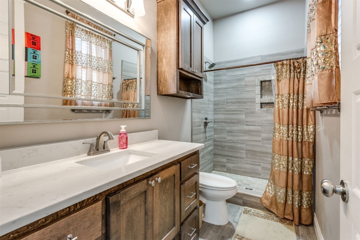 3910 Sienna Ridge, Newcastle, OK 73065 bathroom with vanity, toilet, and a shower with curtain