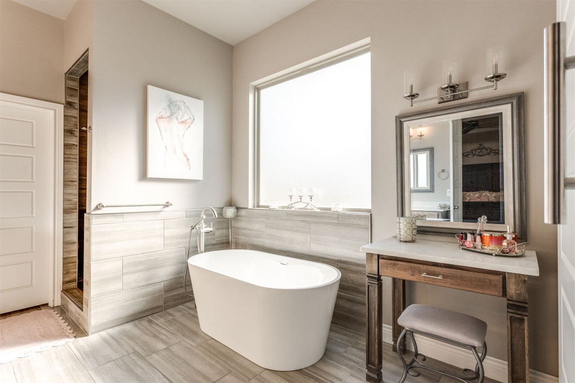3910 Sienna Ridge, Newcastle, OK 73065 bathroom with tile floors, a washtub, tile walls, and vanity