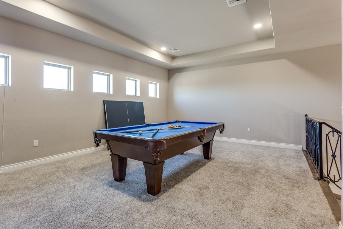 3910 Sienna Ridge, Newcastle, OK 73065 recreation room featuring light carpet, billiards, a raised ceiling, and a healthy amount of sunlight