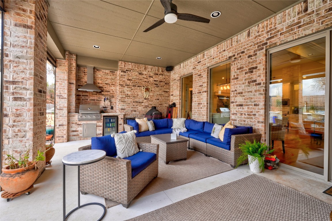 5008 Isle Bridge Court, Edmond, OK 73034 view of patio / terrace with a grill, an outdoor living space, and ceiling fan