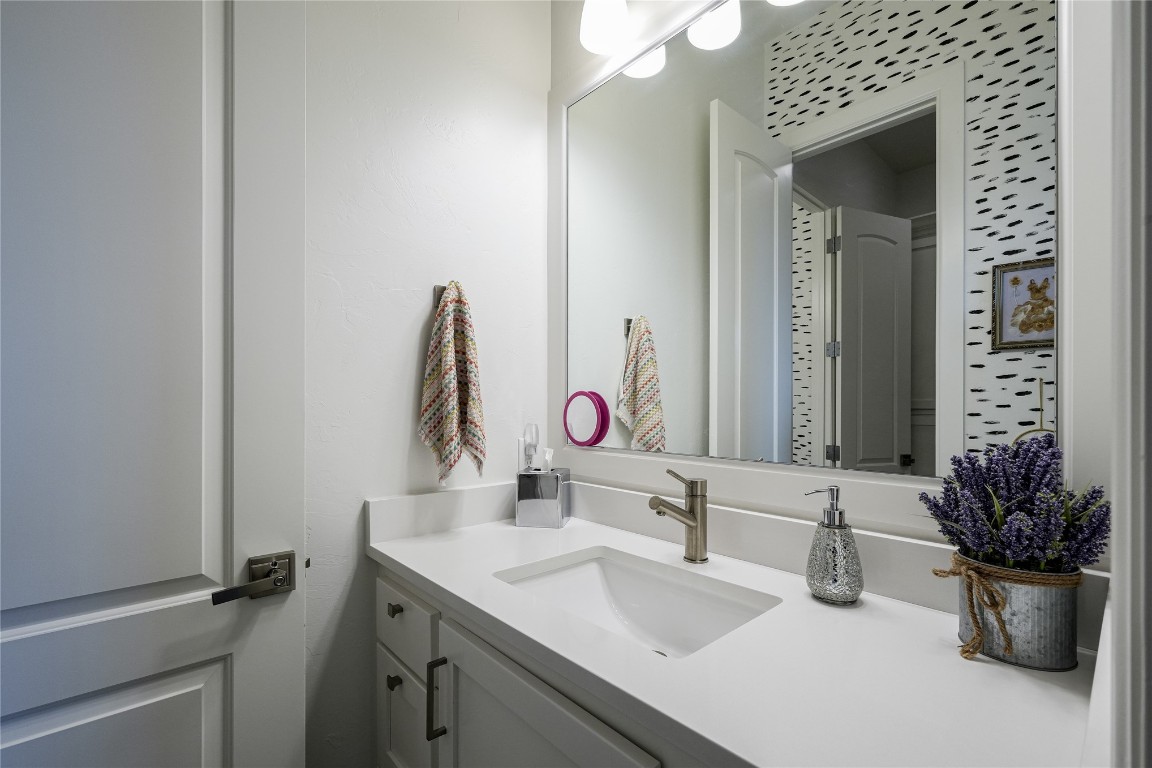 5008 Isle Bridge Court, Edmond, OK 73034 bathroom featuring vanity with extensive cabinet space