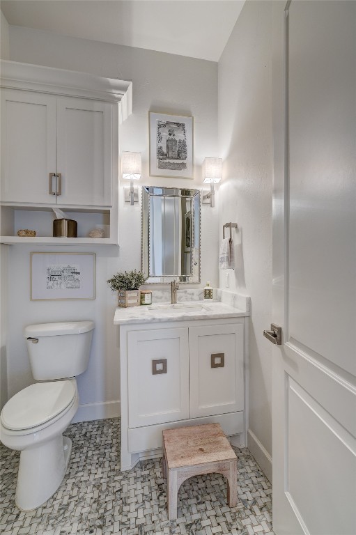 5008 Isle Bridge Court, Edmond, OK 73034 bathroom featuring vanity, toilet, and tile flooring