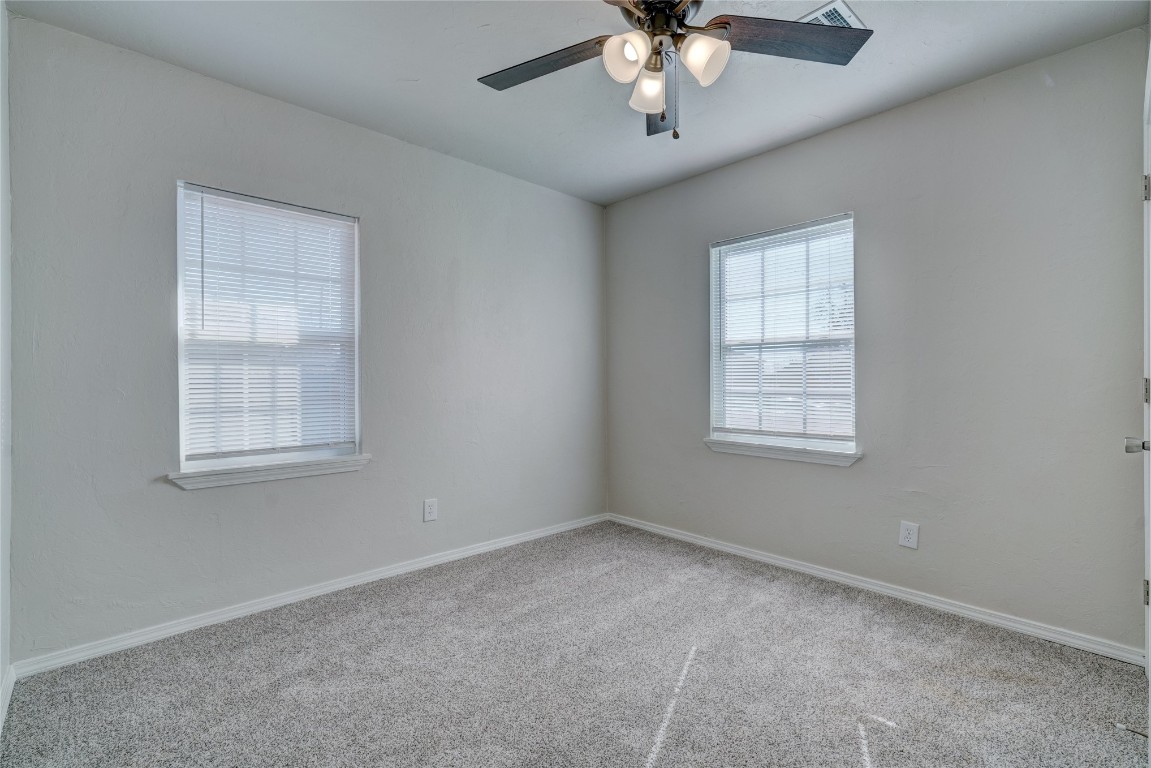 2817 SE 56th Street, Oklahoma City, OK 73129 carpeted spare room with ceiling fan
