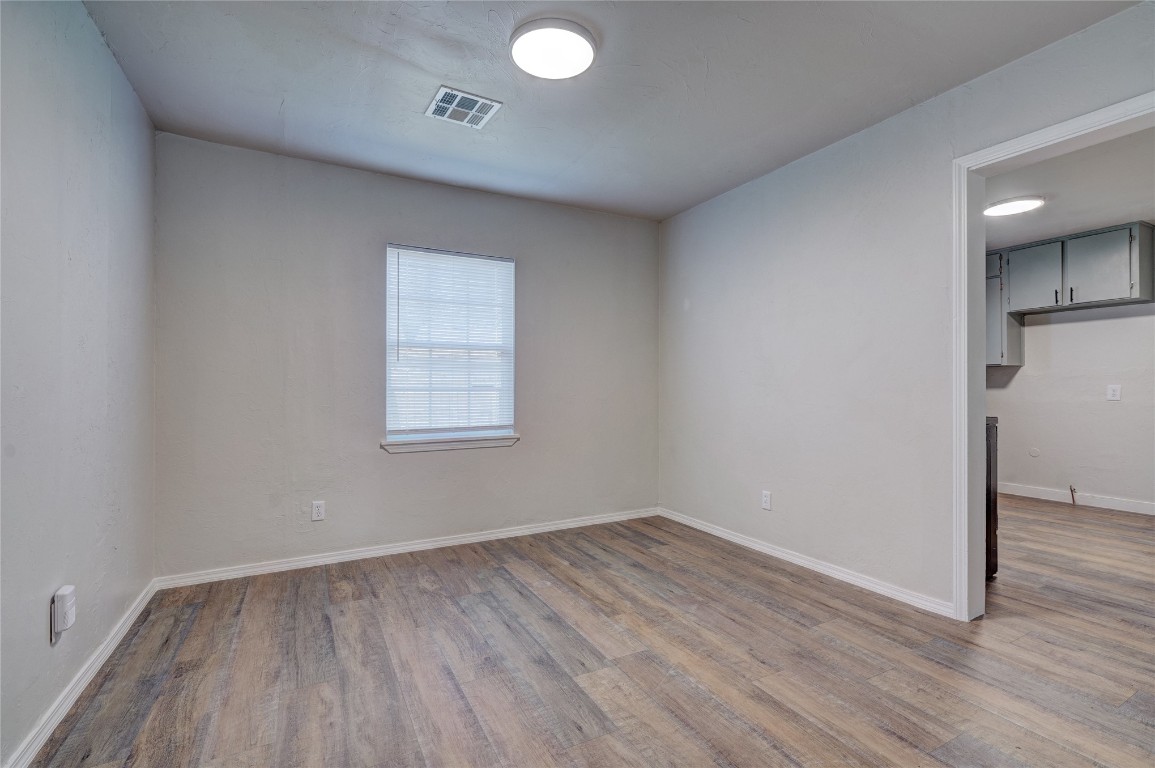 2817 SE 56th Street, Oklahoma City, OK 73129 spare room featuring hardwood / wood-style floors