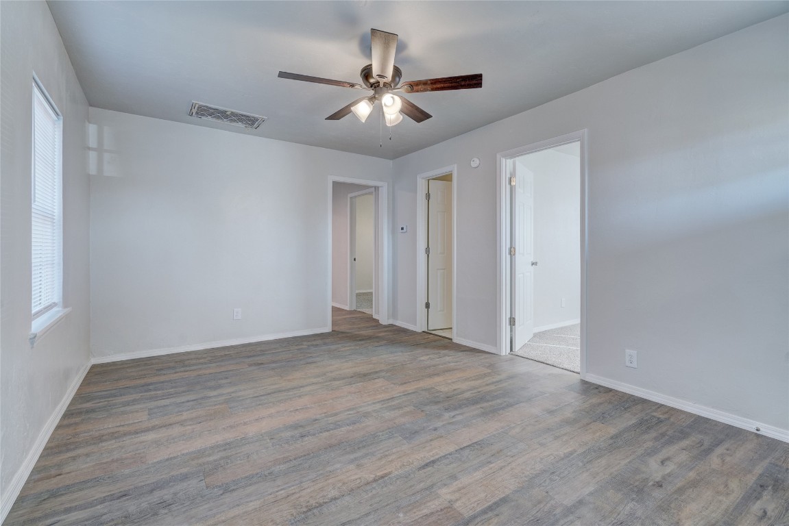 2817 SE 56th Street, Oklahoma City, OK 73129 empty room featuring dark hardwood / wood-style floors and ceiling fan