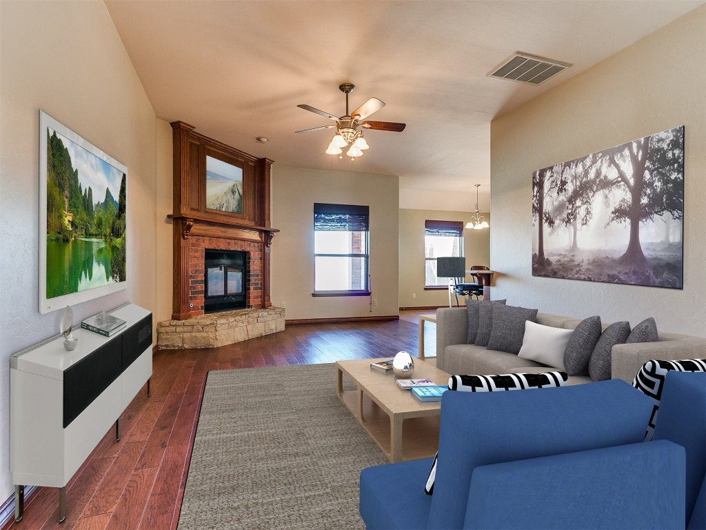 12400 Olivine Terrace, Oklahoma City, OK 73170 living room featuring dark wood-type flooring and ceiling fan