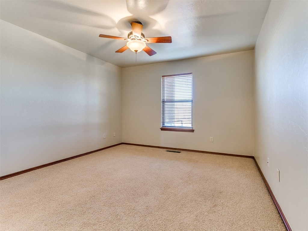 12400 Olivine Terrace, Oklahoma City, OK 73170 unfurnished room featuring light carpet and ceiling fan