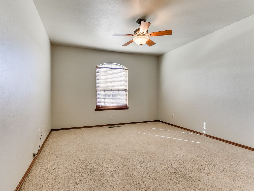 12400 Olivine Terrace, Oklahoma City, OK 73170 carpeted spare room featuring ceiling fan