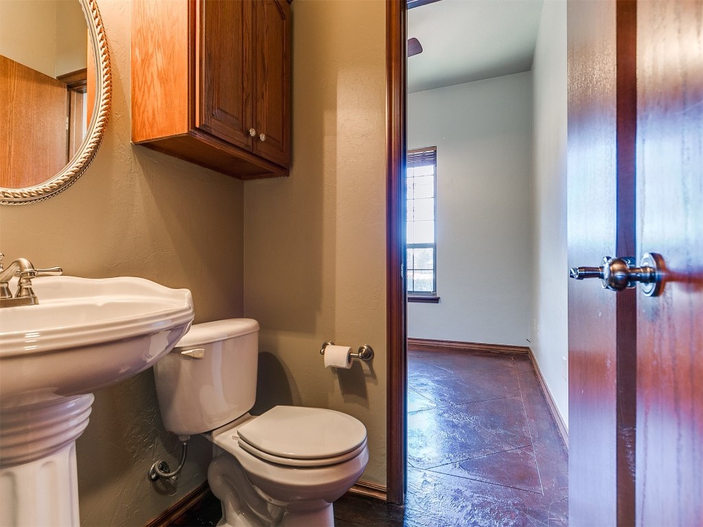 12400 Olivine Terrace, Oklahoma City, OK 73170 bathroom featuring sink, tile floors, and toilet