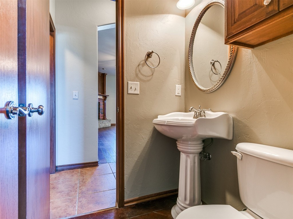 12400 Olivine Terrace, Oklahoma City, OK 73170 bathroom featuring sink, toilet, and tile flooring