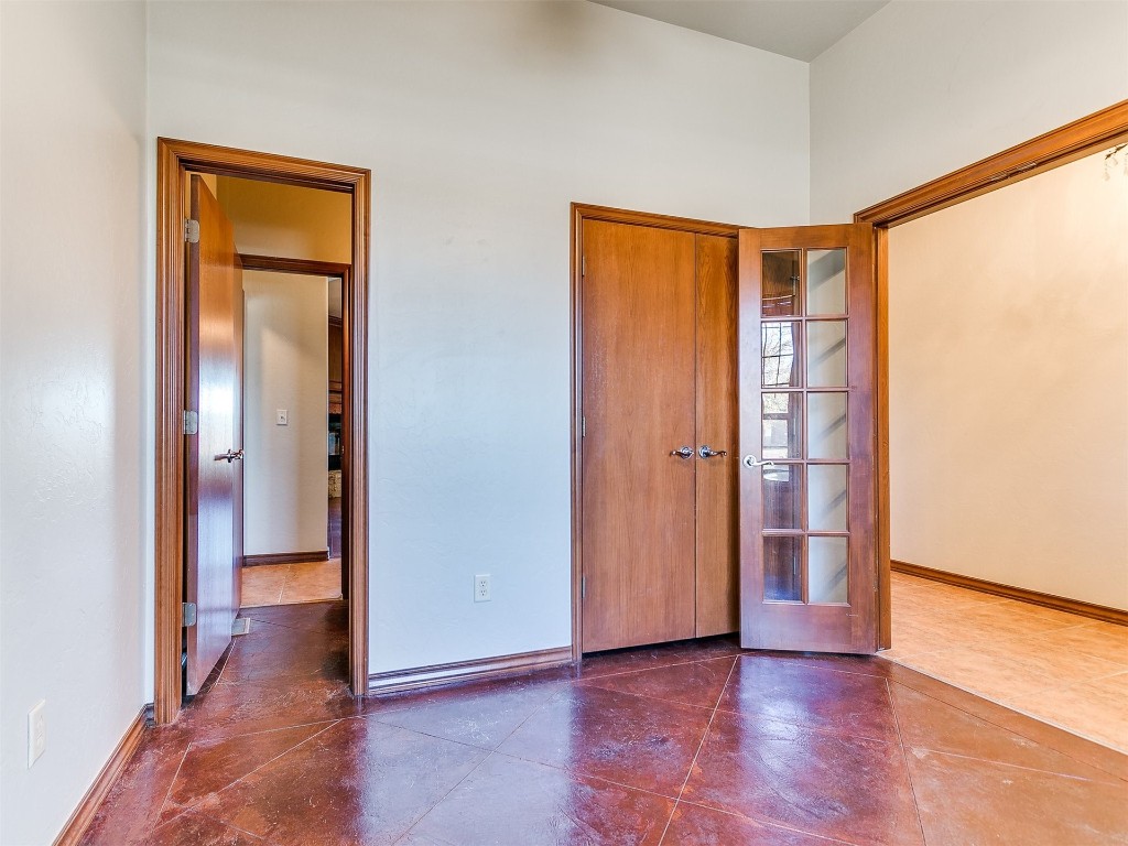 12400 Olivine Terrace, Oklahoma City, OK 73170 unfurnished bedroom featuring dark tile floors and a closet
