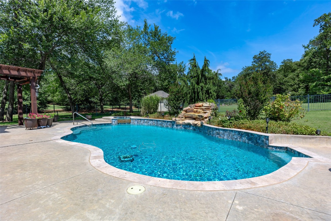 4508 Jacobs Lane, Choctaw, OK 73020 view of pool featuring a pergola, pool water feature, and a patio
