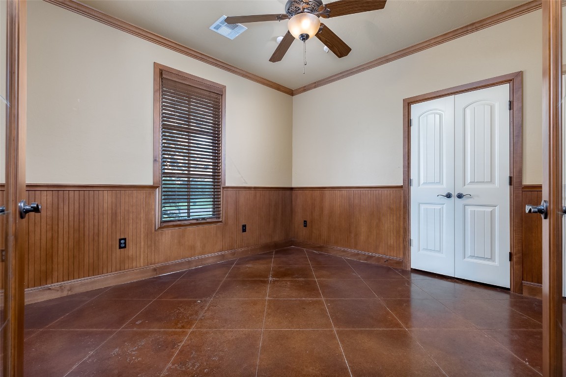 4508 Jacobs Lane, Choctaw, OK 73020 tiled empty room with crown molding and ceiling fan