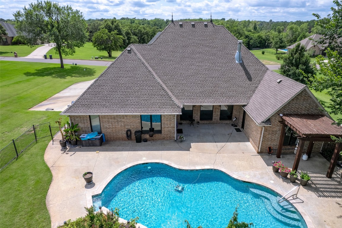 4508 Jacobs Lane, Choctaw, OK 73020 view of pool with a patio and a lawn