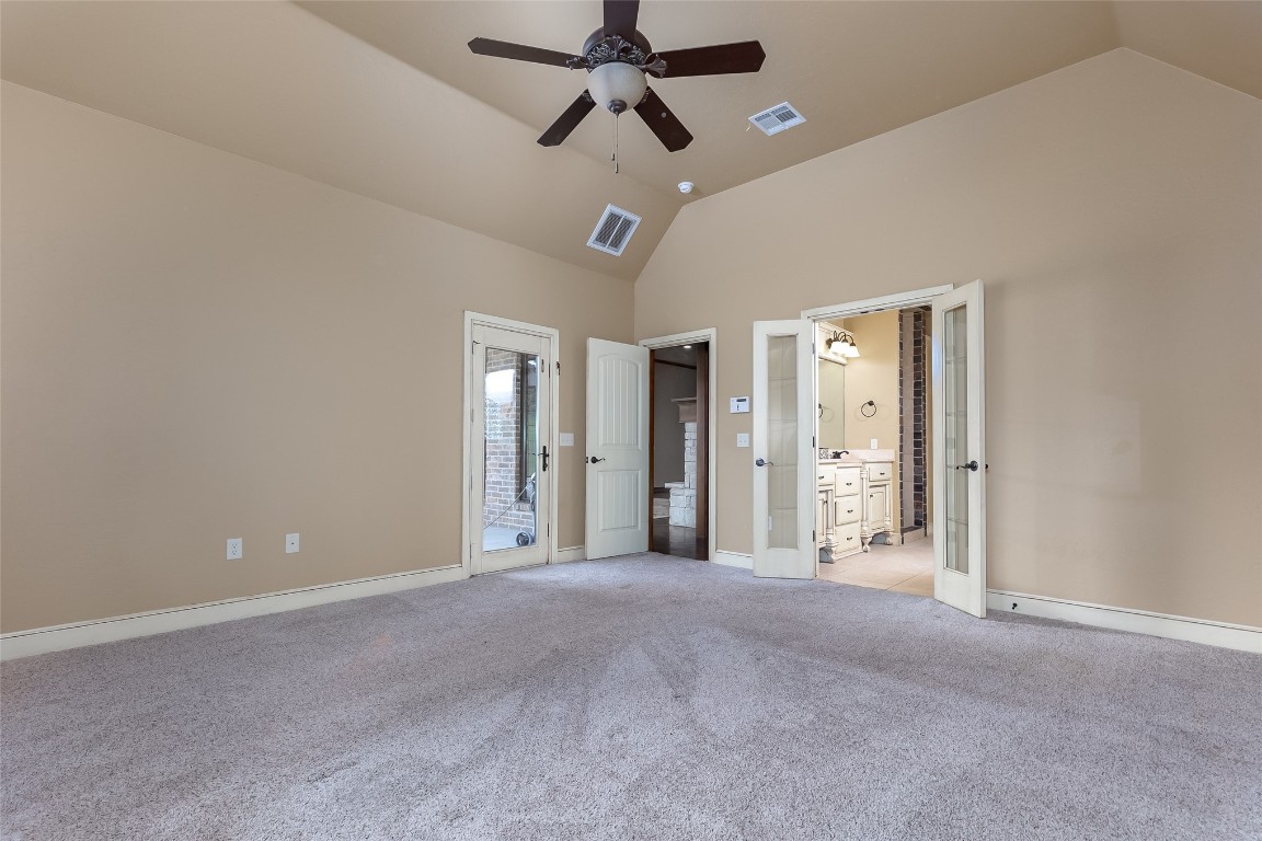 4508 Jacobs Lane, Choctaw, OK 73020 carpeted empty room with high vaulted ceiling and ceiling fan