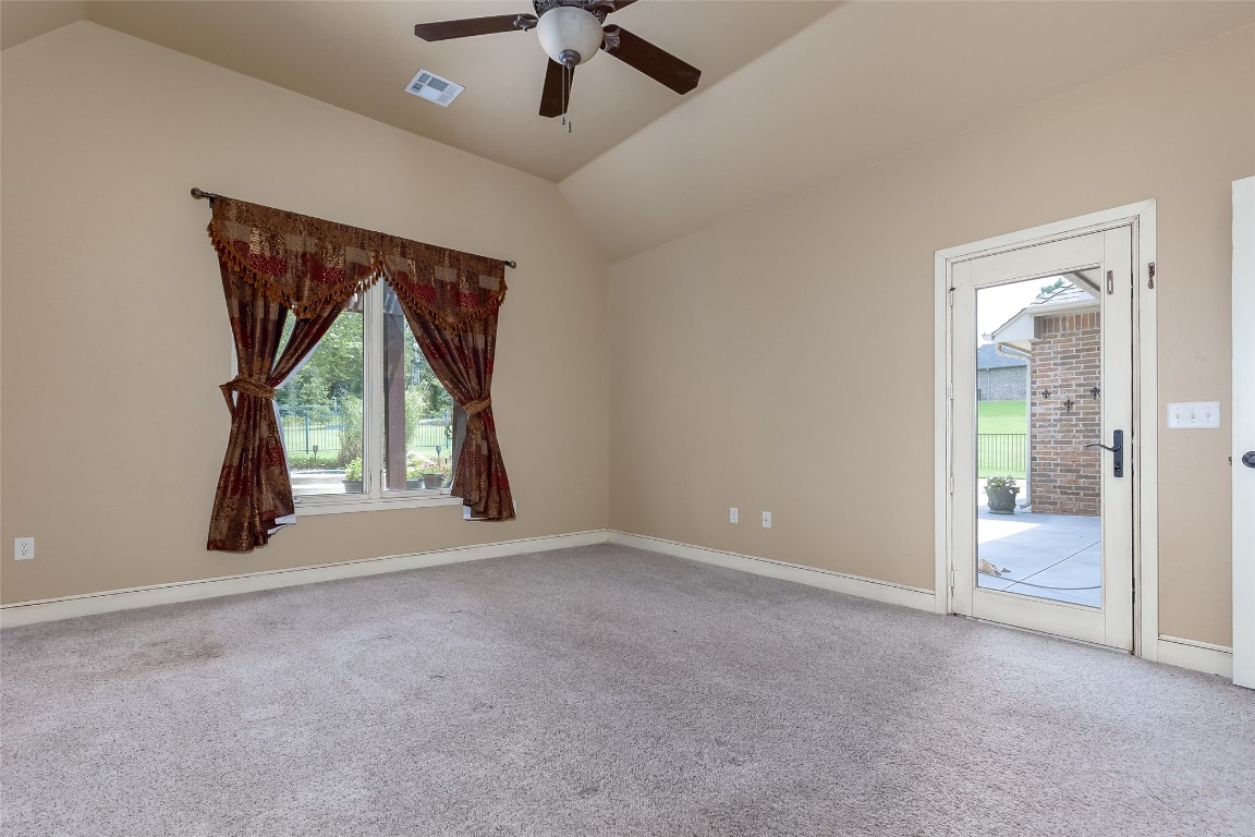 4508 Jacobs Lane, Choctaw, OK 73020 unfurnished room featuring vaulted ceiling, light carpet, and ceiling fan