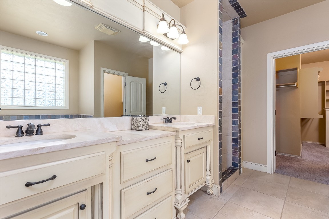 4508 Jacobs Lane, Choctaw, OK 73020 bathroom featuring dual vanity and tile flooring