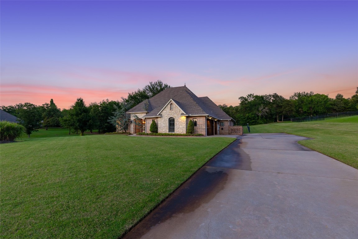 4508 Jacobs Lane, Choctaw, OK 73020 french country style house featuring a lawn