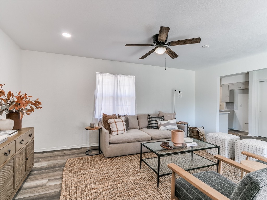908 NW Van Buren Avenue, Piedmont, OK 73078 living room with dark wood-type flooring and ceiling fan
