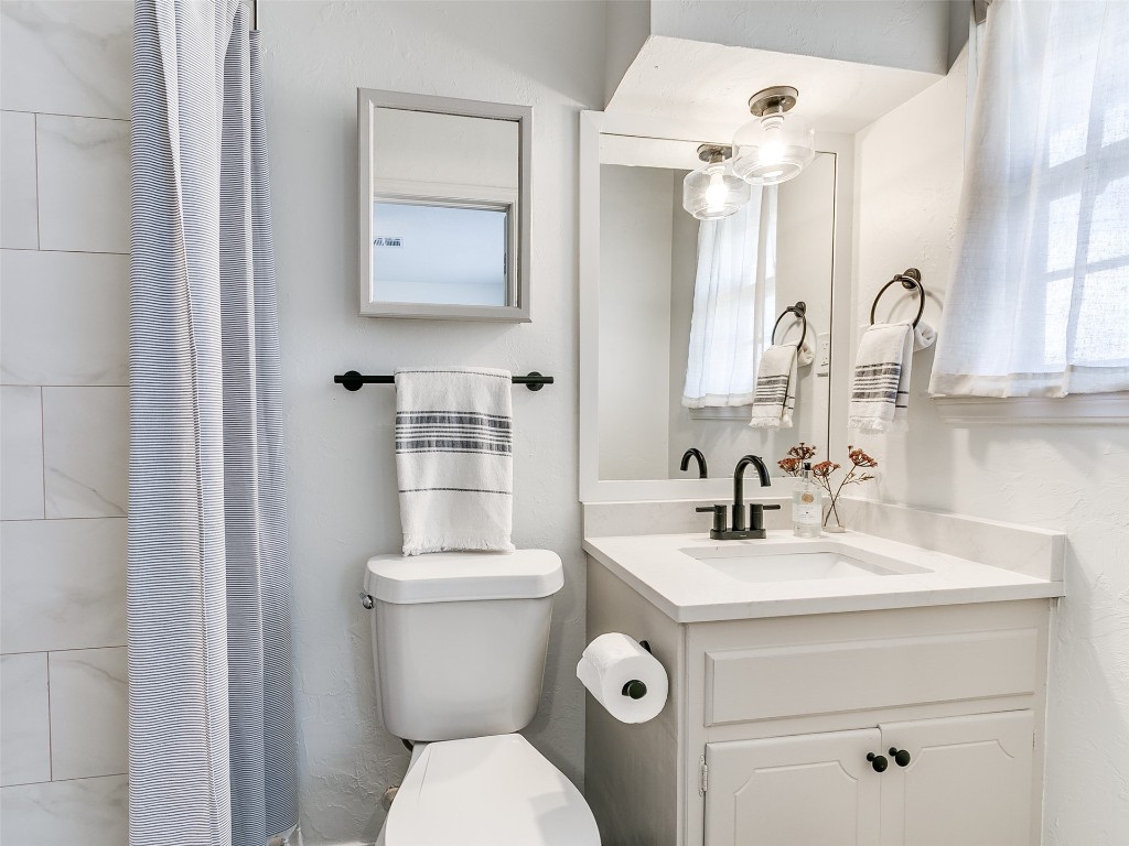 908 NW Van Buren Avenue, Piedmont, OK 73078 bathroom featuring vanity and toilet