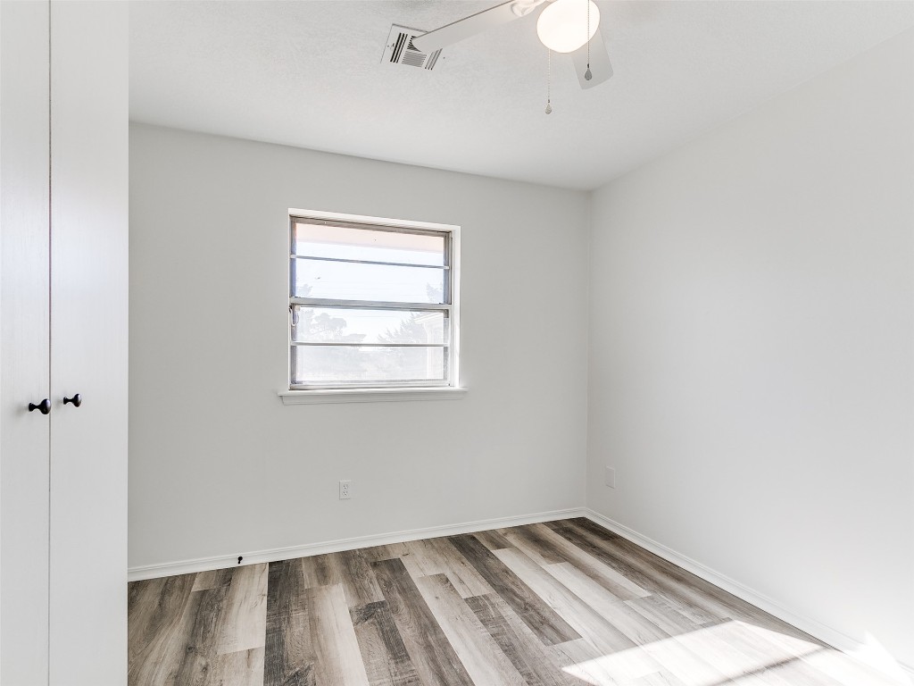908 NW Van Buren Avenue, Piedmont, OK 73078 empty room with light wood-type flooring and ceiling fan