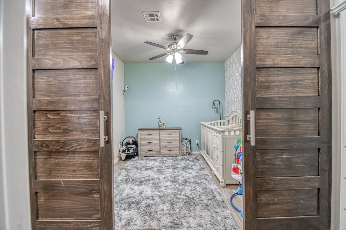3935 Huntington Parkway, Choctaw, OK 73020 unfurnished bedroom featuring carpet floors and ceiling fan