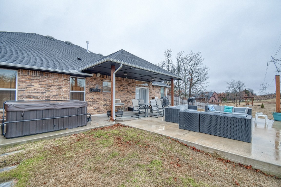 3935 Huntington Parkway, Choctaw, OK 73020 exterior space featuring an outdoor living space, a patio area, and a hot tub