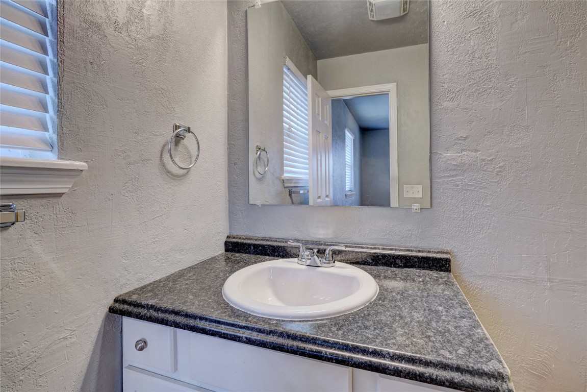 44 SE 57th Street, Oklahoma City, OK 73129 bathroom with radiator and oversized vanity