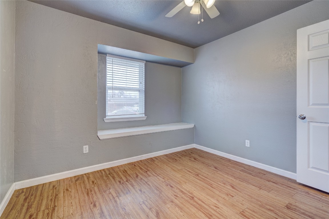 44 SE 57th Street, Oklahoma City, OK 73129 unfurnished room with ceiling fan and light wood-type flooring
