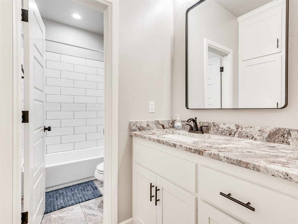 4512 Hidalgo Avenue, Mustang, OK 73064 full bathroom featuring vanity, toilet, tub / shower combination, and tile flooring