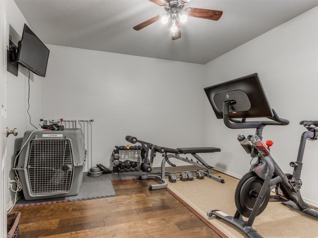 2812 NW 169th Street, Edmond, OK 73012 workout area featuring dark hardwood / wood-style flooring and ceiling fan