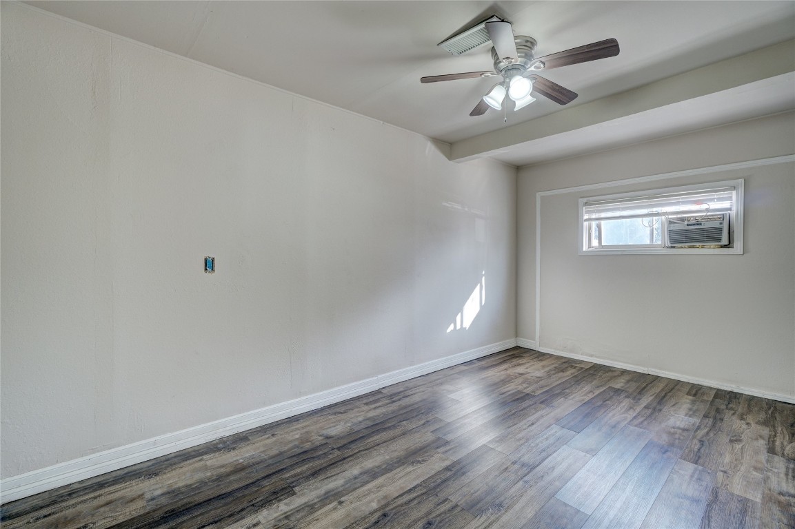 2505 N Hammond Avenue, Oklahoma City, OK 73127 spare room with dark hardwood / wood-style flooring and ceiling fan