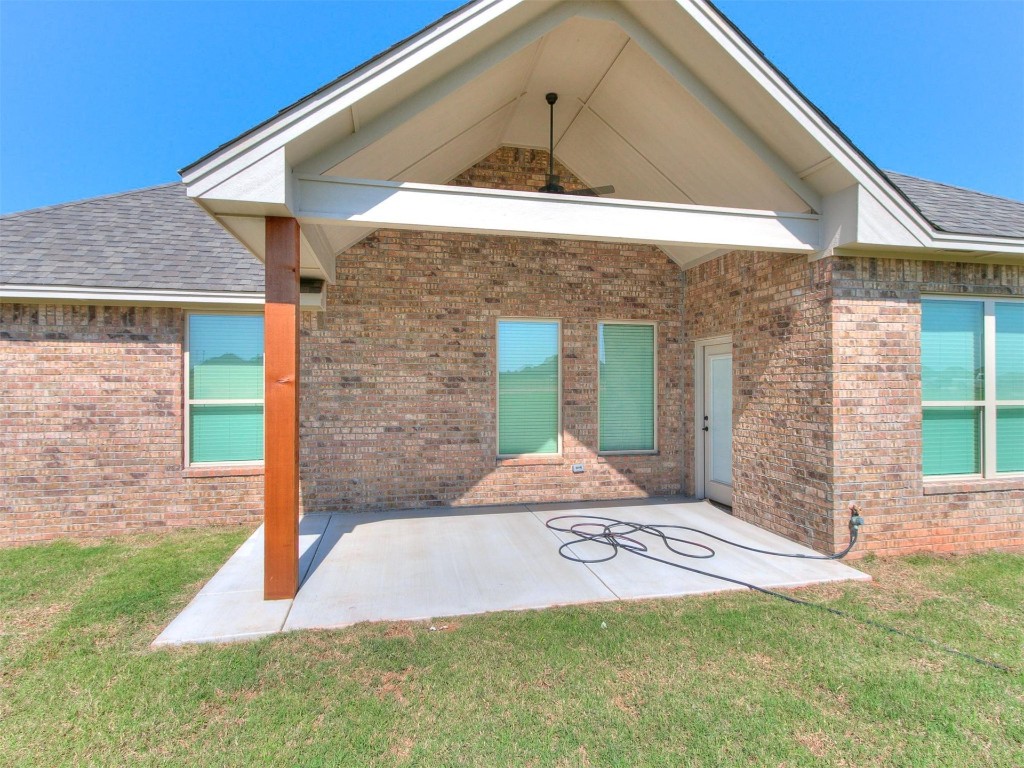 1226 Deer Ridge Boulevard, Tuttle, OK 73089 exterior space with a lawn and a patio area