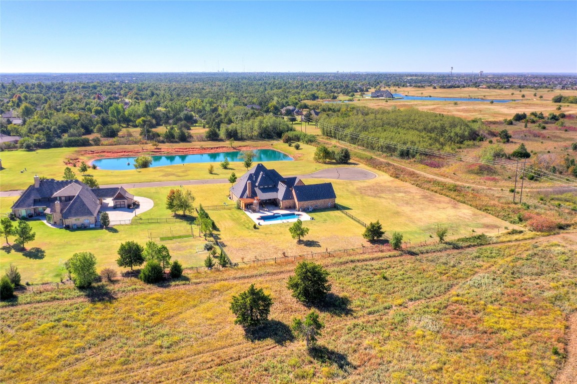 2355 La Belle Rue, Edmond, OK 73034 aerial view featuring a rural view and a water view