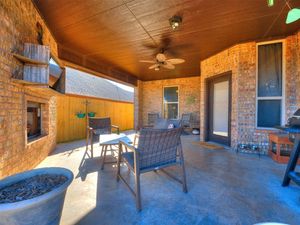 112 Old Home Place, Yukon, OK 73099 view of patio featuring a fireplace and ceiling fan
