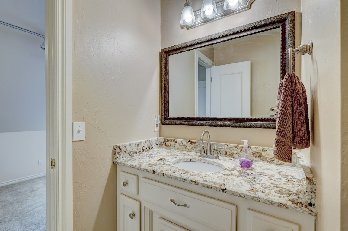 1941 Oak Creek Terrace, Edmond, OK 73034 bathroom featuring vanity