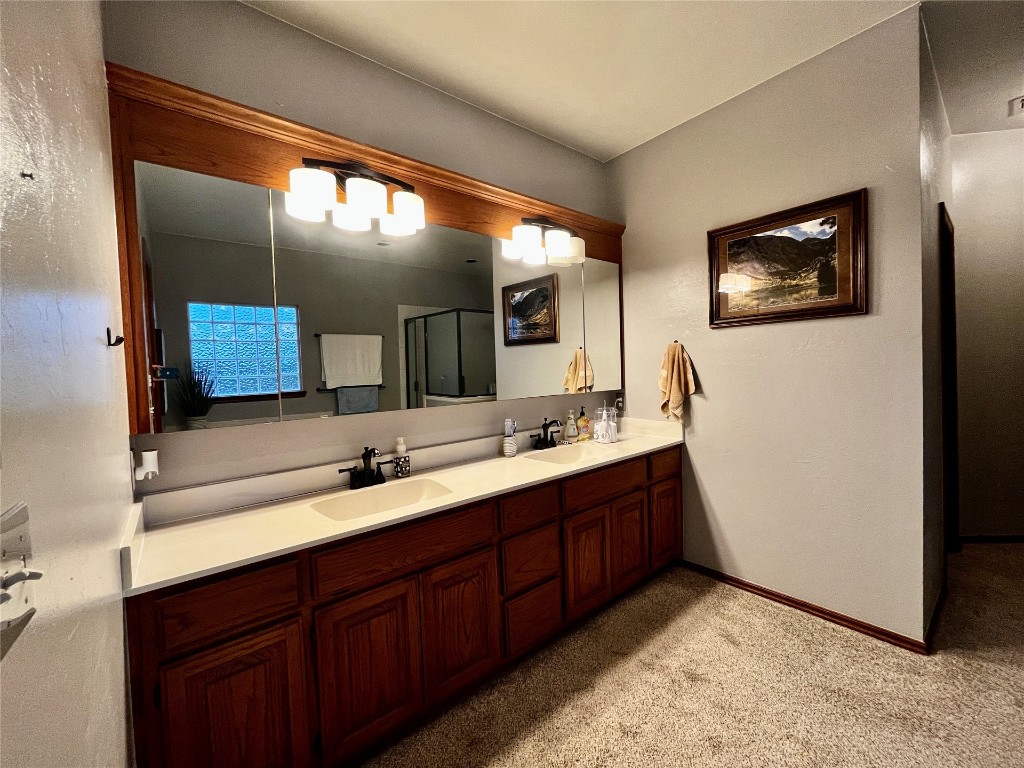 5808 E McMillin Dr, Tuttle, OK 73089 bathroom with double sink vanity