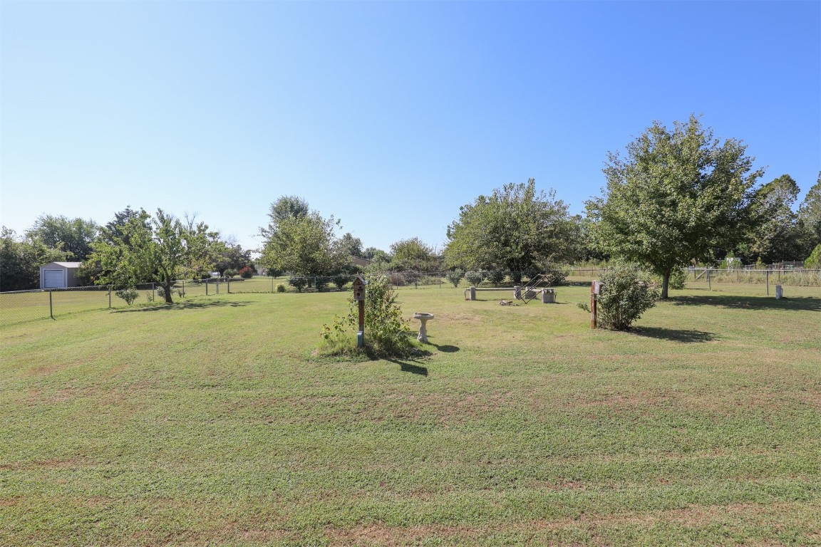 5808 E McMillin Dr, Tuttle, OK 73089 view of yard with a rural view