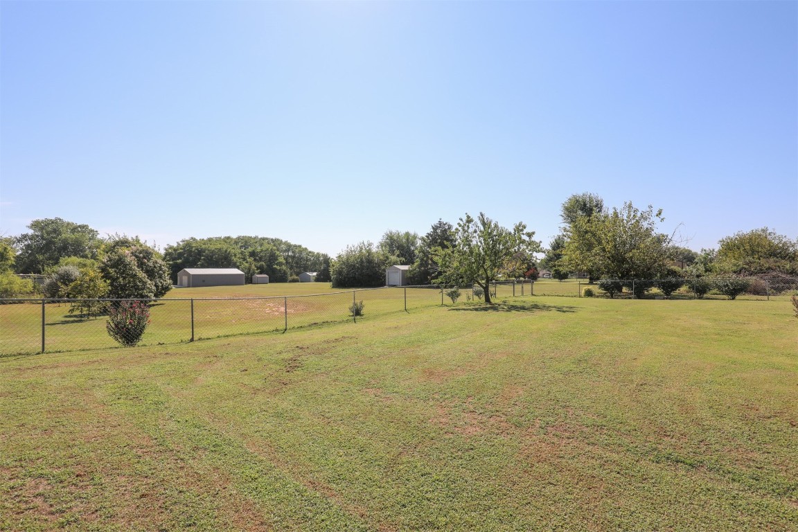 5808 E McMillin Dr, Tuttle, OK 73089 view of yard featuring a rural view
