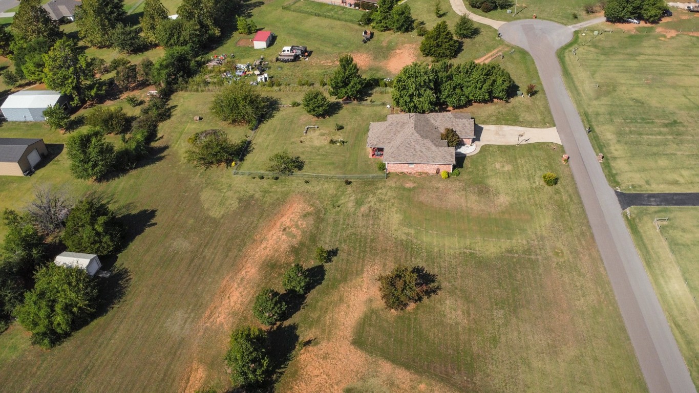 5808 E McMillin Dr, Tuttle, OK 73089 birds eye view of property with a rural view