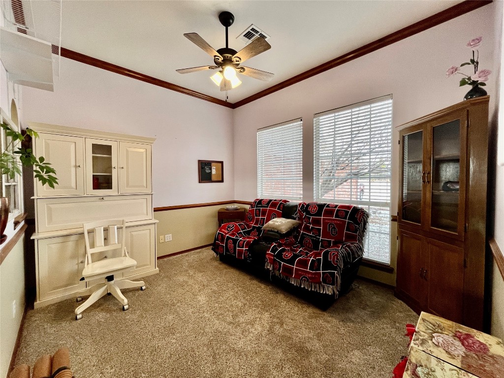 5808 E McMillin Dr, Tuttle, OK 73089 interior space with crown molding and ceiling fan