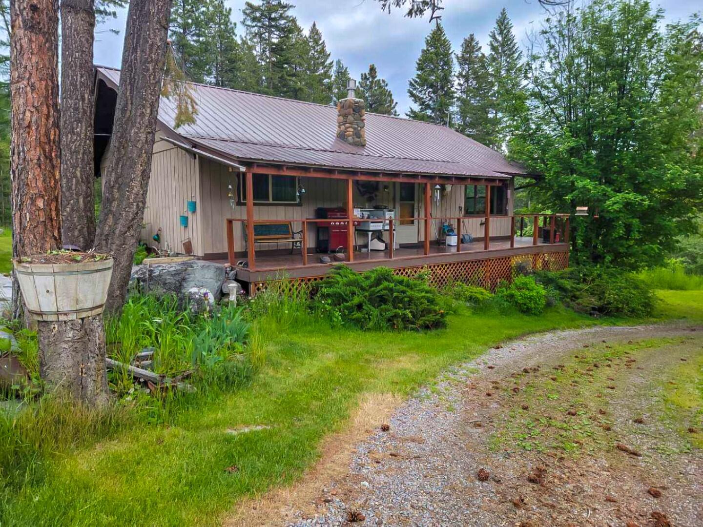 2-home property, Primary residence is a 2030sf 3/2, the daylight basement has a separate entry, a vault room & has many updates. Guest home was constructed 2019 & is a 1300sf 3/2 on a poured foundation & its own septic system. Home has solid core doors, rock fireplace & many other upgrades. The property includes a 32x40 heated shop w/22x40 lean-to, a 24x30 carport & 100' of commercial highway frontage. Guest home recently rented for 6 months over the winter @$3000 per month. Property is perfect for an investor to net multiple streams of income or a growing family. A manicured 5-acre forest is full of wildlife & offers privacy & great views from the deck as you enjoy your morning coffee. Call Dave Wood at 406-314-5858, or your real estate professional.