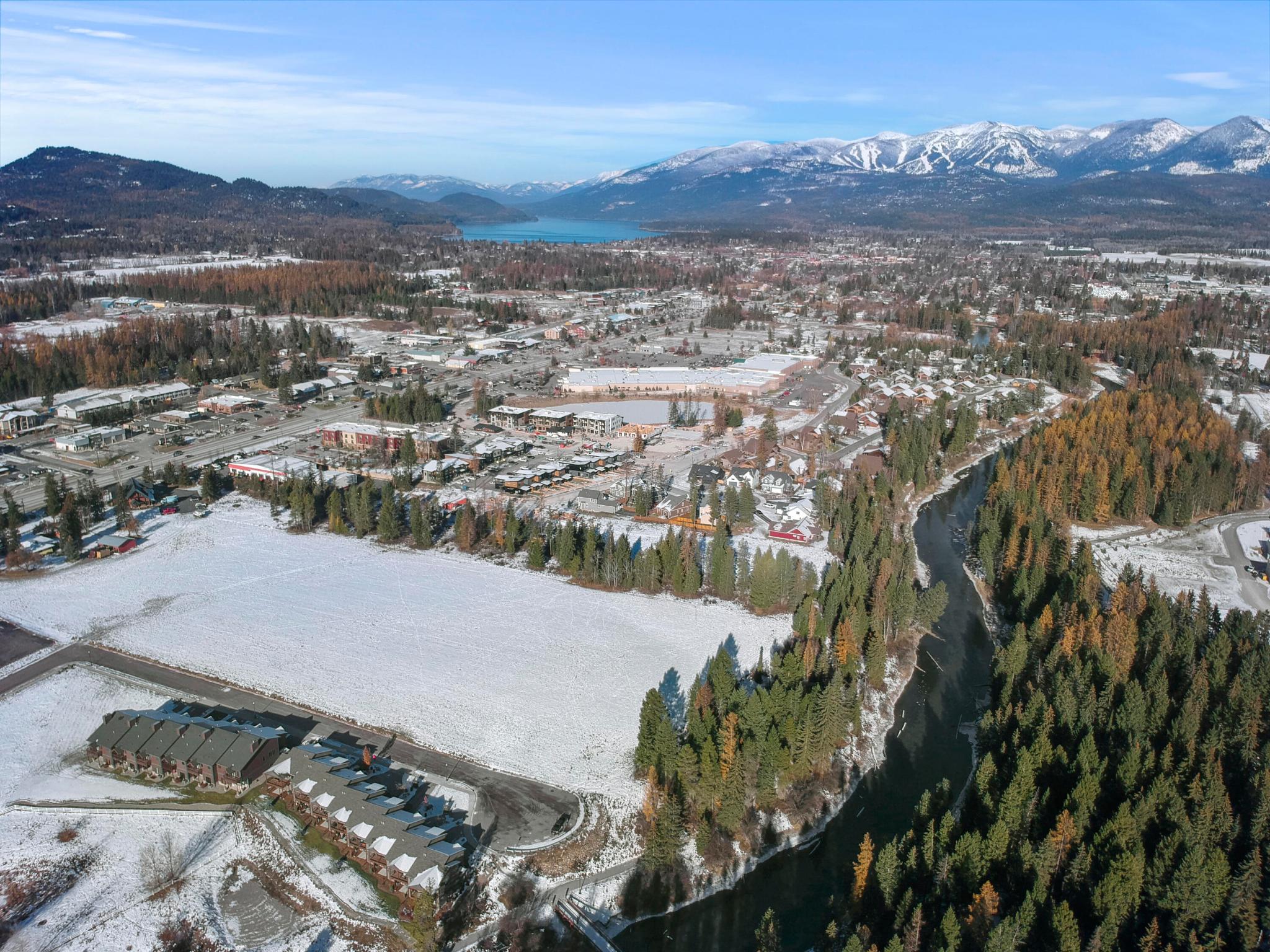 Welcome to Snowy Mountain, Whitefish's newest premier planned development community, along the banks of the gorgeous Whitefish River. With 24 duplex townhome lots, future homeowners will be well positioned to access all of Whitefish and the Flathead Valley. Lot 22 borders the Whitefish Riverwalk, with prime west-facing river views. Enjoy the nearby convenience of grocery stores and coffee shops. Downtown Whitefish, with its vibrant shopping and dining scene, is down the road, while the Ski Resort is 18 minutes to the Base Lodge. Construction begins this spring with a projected early Fall completion. Contact Kaleb Retz (406-546-8987) or your Real Estate Professional.