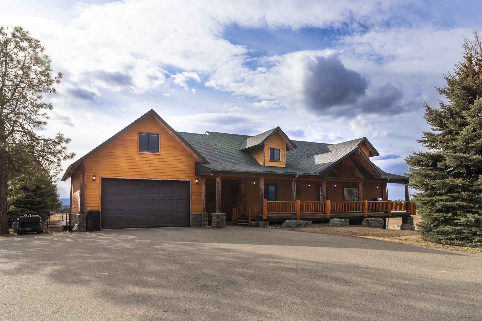 This unique, one-of-a-kind property fronting HWY 2 just north of airport, is zoned Scenic Corridor so it can be used for a multitude of options, such as commercial, light industrial, ag, and more. The property includes a
Spectacular Montana-style home on just over 48 acres with 3 BDS & 2.5 BTHS in main living area, and a full walkout basement apartment with 2BDS, 1 BTH, kitchen and laundry. Both levels have separate entrances, spacious, open-concept floor plans and extra insulation for sound-proofing. Large, partially covered wrap-around deck with views of ski area, mountains, and Glacier Park for all your outdoor entertaining. Home and apartment have been used for successful short-term rentals due to close proximity to airport. Horse enclosure/lean-tos have corral and attached divided fenced areas for multiple animals.  So many options with this property. A must see! Call Marcie West 406*253*2552or your real estate professional today. Property has a mobile home on it that is currently being rented and is included in sell, possibly no value. Property consists of three tracts of land with three addresses. 103,115,127 Wishart Road. Call for more information.