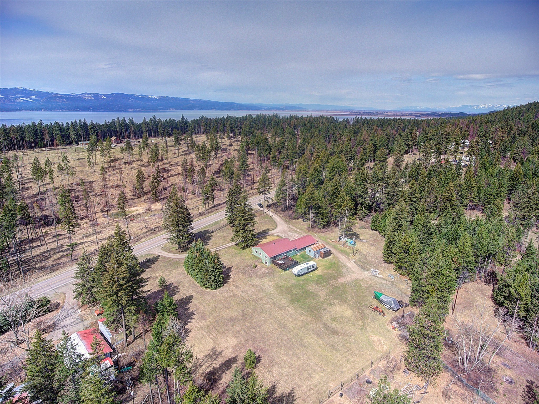 The potentials are endless with 3.5 "Un-zoned" level acres and 450' of Mt Highway 35 frontage.  Boat Storage, Cherry Orchard, Vacation Rentals are all possibilities.
  
For more information, Call Larry Sartain at 406-871-5000 or your real estate professional.