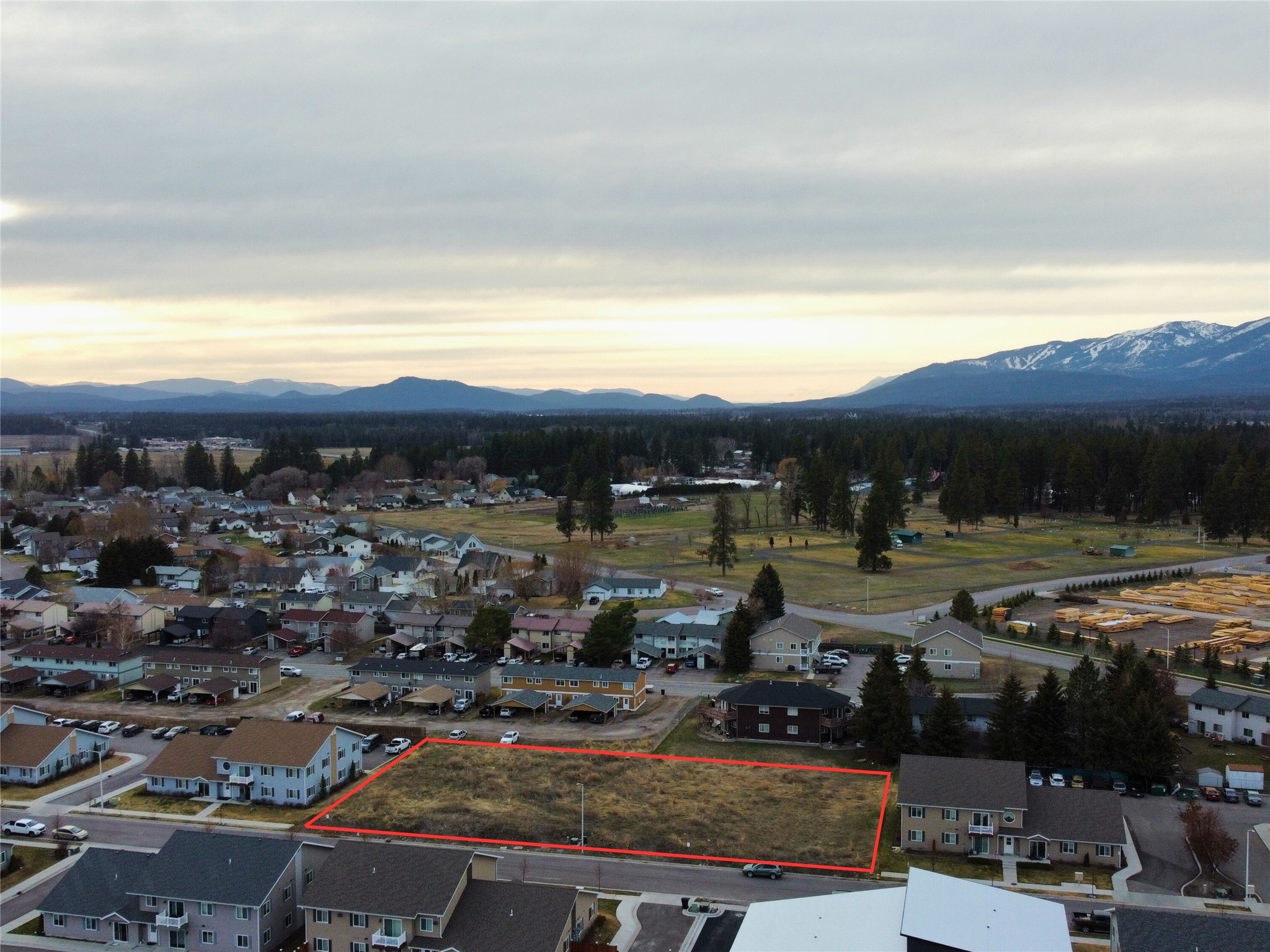 Investors take note! This .68 acre lot is primed and ready – with ALL PERMITS APPROVED – for (2) 6-plex buildings (a total of 12 doors) in the charming and growing town of Columbia Falls. With building plans already approved by the city, each unit is designed for maximum efficiency and storage: 3 bedrooms, 2 bathrooms, 1,000+ SF, lots of natural light, in-unit laundry, deck, single garage space, additional rear parking space on-site and designed with a shared driveway between both buildings. Conveniently located in-town, these lots are surrounded by other successful multi-family buildings, treelined sidewalks, and there's a community park/playground in the neighborhood.  Just 10 minutes to the International Airport, 25 minutes to Kalispell, 15 minutes to Whitefish and 30 minutes to Glacier National Park. Call Liz McGavin (406-212-3702) or your Real Estate professional.