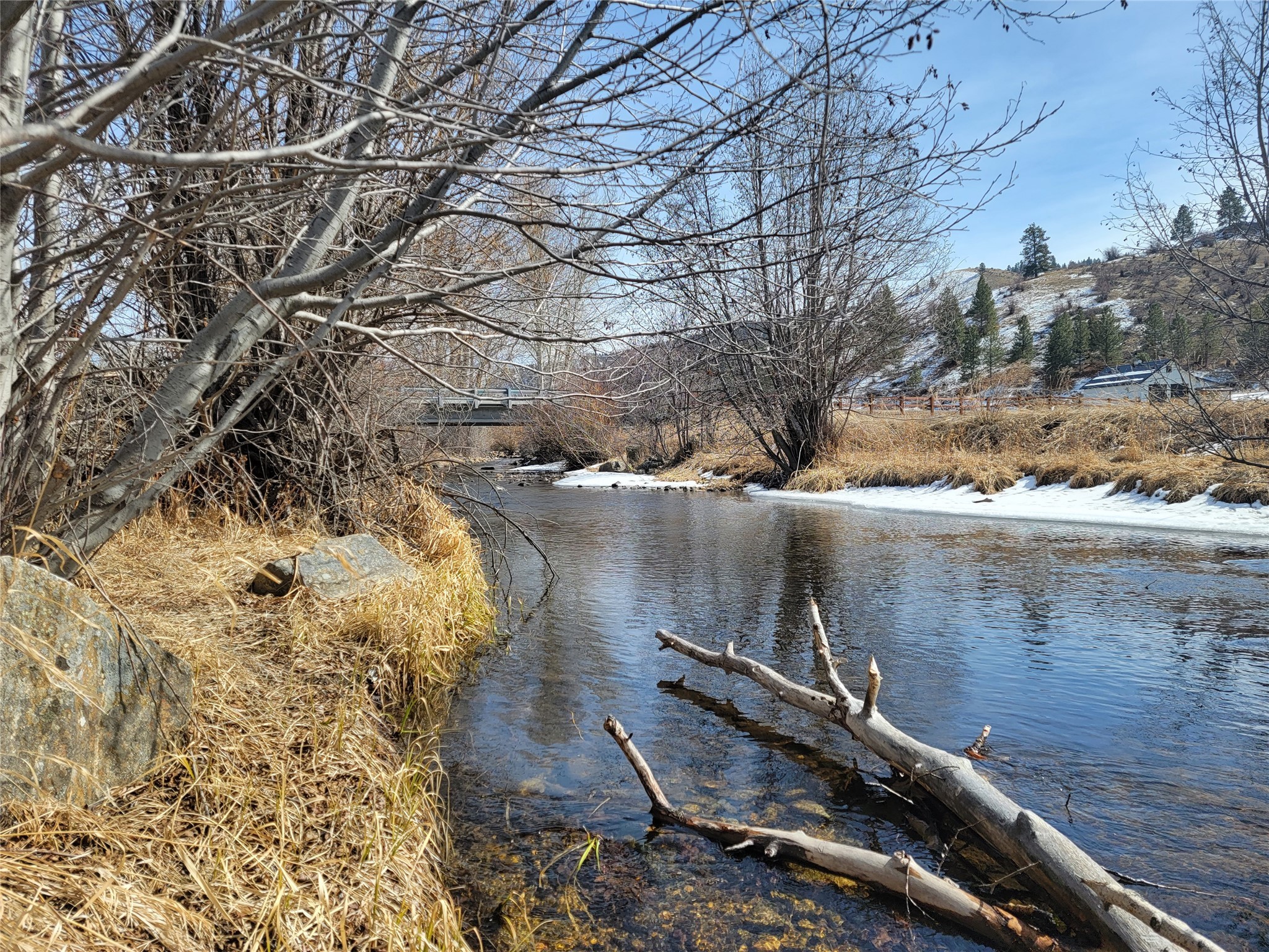 This property has everything you could ask for! Creek frontage, beautiful views, a large pond, and water rights. Build your dream home on this 8.47+/- acre parcel, just 15 minutes from Hamilton on paved roads. Please call Carleton Clifford at 406-369-0871 or your Real estate professional.