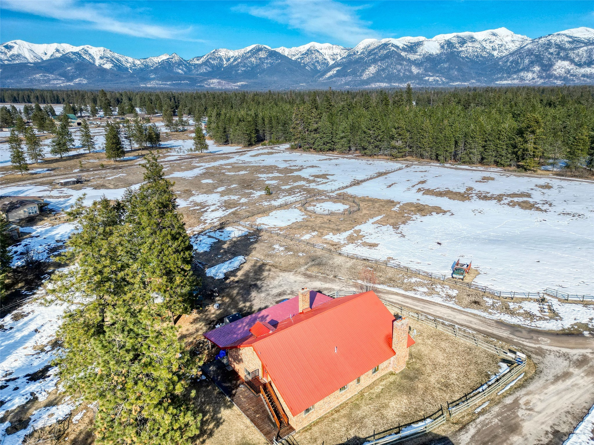 Amazing investment opportunity! Sitting on just over 10 acres, this beautiful oasis in the woods of Bigfork features 4 income-producing units. With stunning views of the mountains, the main home features just over 2,500 square feet, 4 bedrooms, 1 bathroom, a built-in wood fireplace, beautiful red oak floors, a loft, vaulted ceilings, one -level living, an open floor plan, large windows and a large, covered patio. Just above the main house, there is a studio apartment with 1 bathroom that features beautiful red oak flooring and amazing storage. 
Additional features of the property include: TWO 1 bedroom/1 bathroom apartments, an attached, large shop with 2 garage doors, and much more. Don’t miss out on your opportunity! Book your showing today! Call Laurie Turner 406-253-4448 or Stephanie Thompson 406-871-8805, or your real estate professional.