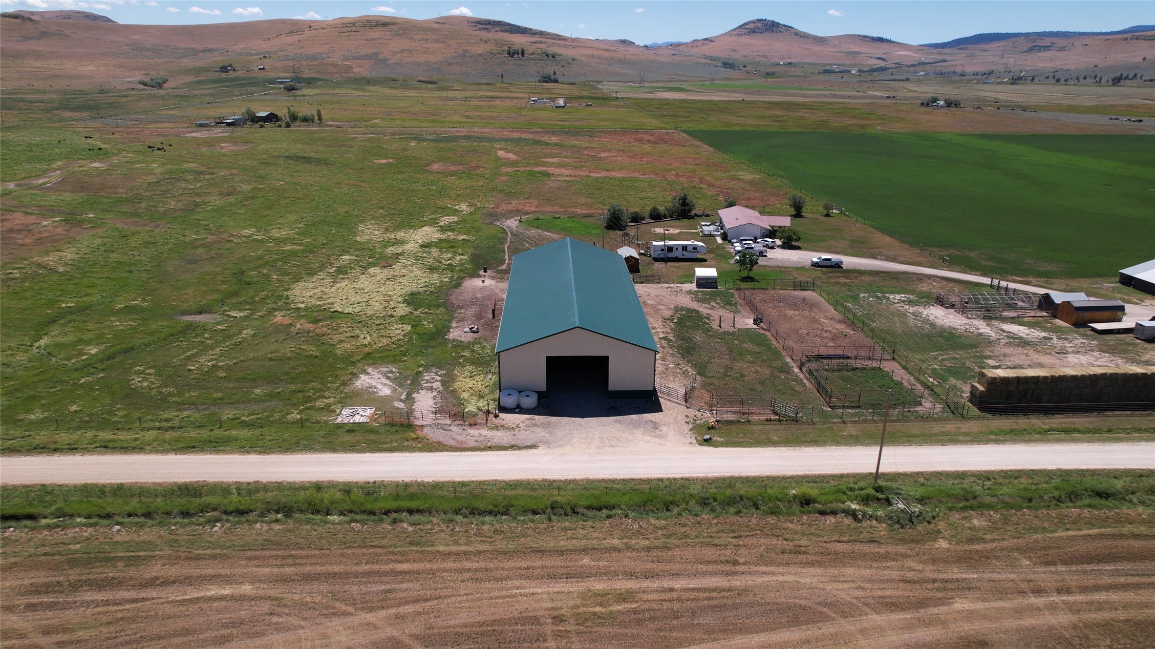 Nestled in the heart of Sanders County, MT, this exceptional 79.70-acre working ranch embodies the essence of a true western lifestyle while offering endless possibilities for both leisure and commerce. From its fertile land, boasting an annual production of six (6) tons of alfalfa, roughly ~40 additional acres of pasture, and versatile infrastructure to its development potential, this property represents an extraordinary opportunity for those seeking a truly unique and prosperous lifestyle. The 3-bedroom, 2.5-bath ranch home has expansive decks on the front and back and an enormous 60ft x 150ft pole barn with 20ft side walls and multiple points of entry and egress.  The detached garage and lean-to add additional storage opportunities for farm and ranch equipment. (See Supplemental Remarks) This impressive property with level terrain boasts a location that provides a blend of privacy and accessibility. Surrounded by picturesque landscapes and natural beauty, the property offers a serene oasis. Thoughtfully developed, this working ranch offers a range of essential amenities to support a variety of agricultural and livestock endeavors. Equipped with fencing, cross-fencing, sturdy buildings, and an efficient irrigation system, including flood irrigation and a center-point pivot, the ranch is fully prepared for any agricultural operation. The expansive pastures provide abundant greenery and ample space for grazing, ensuring optimal conditions for the well-being of cattle, horses, or other livestock.


The extensive acreage and desirable location of this ranch provide an exceptional opportunity for development. Whether it be an exclusive equestrian estate, a premier vacation retreat, or a luxury ranch community, the possibilities to shape this land into a distinctive residential or commercial endeavor are virtually limitless.


Despite its tranquil and secluded ambiance, the ranch is conveniently located within easy reach of major transportation routes, ensuring convenient access to nearby towns, cities, and amenities. Additional acreage may also be available. 



Contact Danya Cotte @ 406-826-4261 or your real estate professional.