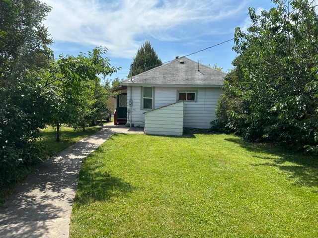 Sweet bungalow in the heart of the city.  Very private, open living and dining area, large kitchen, two bedrooms, large laundry room, update bathroom. Landscaped with many fruit trees, shed at rear of property, additional parking from the alley.  A must see property. Call Shirley Tyler at 406-250-6445, or your real estate professional.